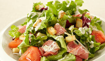 New menu item Caesar salad with uncured ham