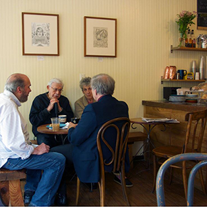 「Artwork above the tables by New Haven artist Leslie Carmin.」